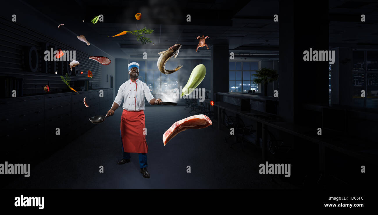 Black man wearing an apron and cooking in action. Mixed media Stock ...