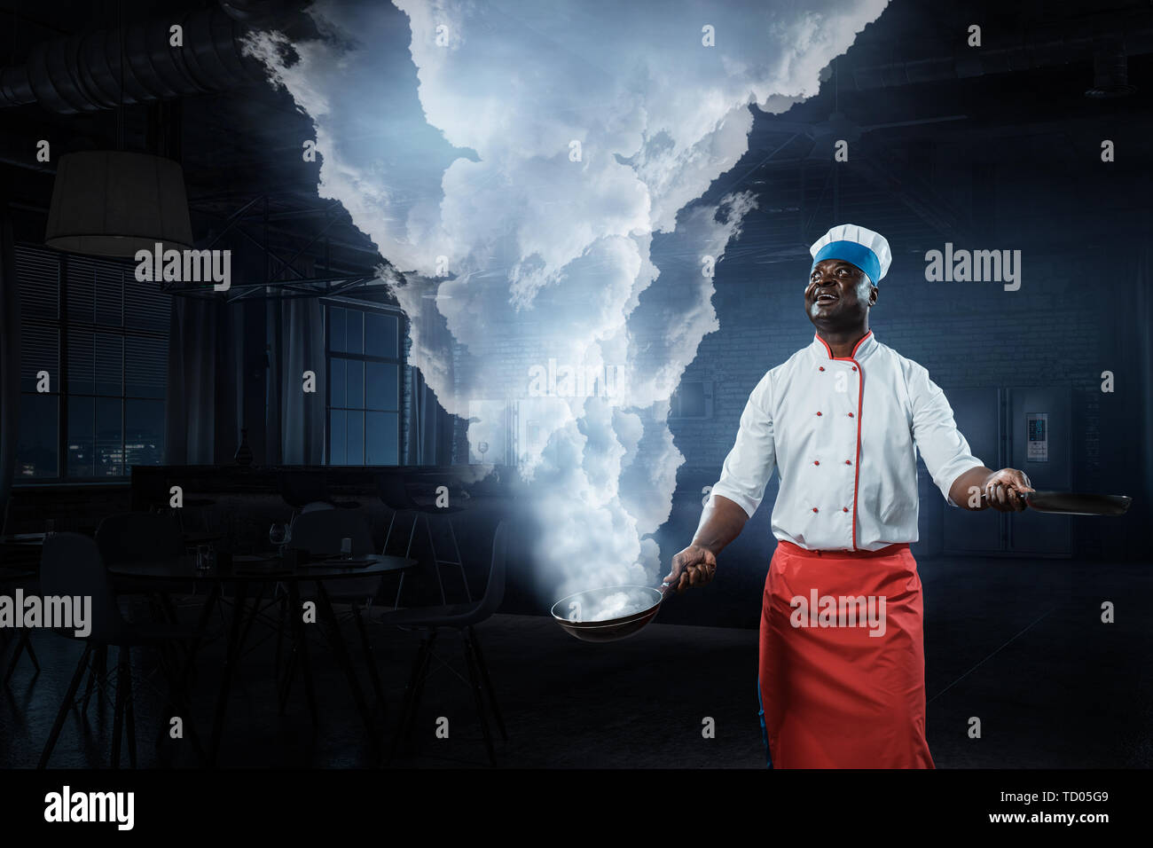 Black man wearing an apron and cooking in action. Mixed media Stock ...