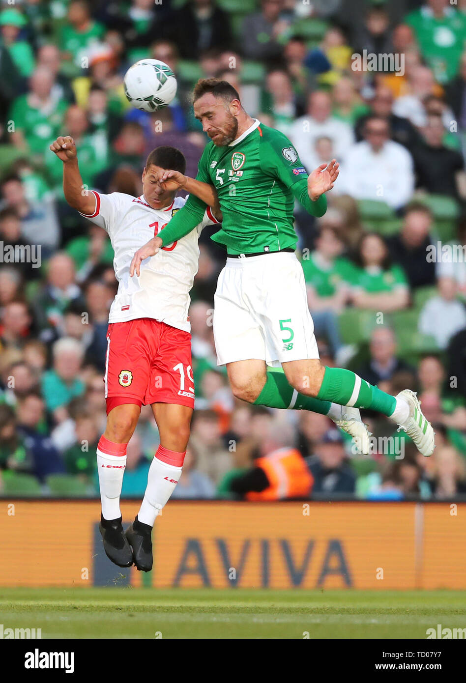 Gibraltar's Tjay De Barr (left) and Republic of Ireland's Richard Keogh battle for the ball during the UEFA Euro 2020 Qualifying, Group D match at the Aviva Stadium, Dublin. Stock Photo