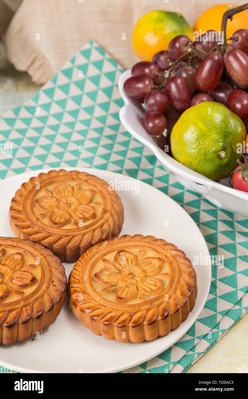 Moon cakes and fruit on the table Stock Photo