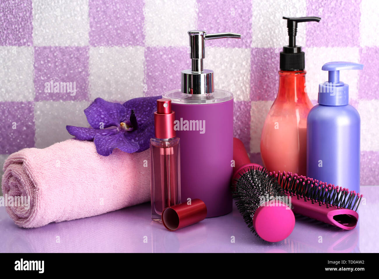 Hair brushes and cosmetic bottles in bathroom Stock Photo Alamy