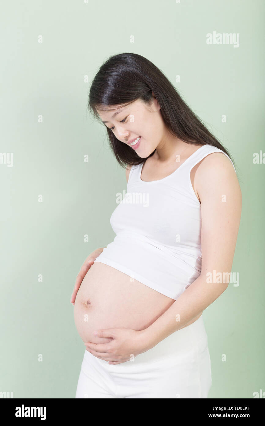 Pregnant Woman Belly Holding a Glass of Water Suggesting Importance To  Hydrate during Pregnancy Stock Photo - Image of standing, hand: 210495202