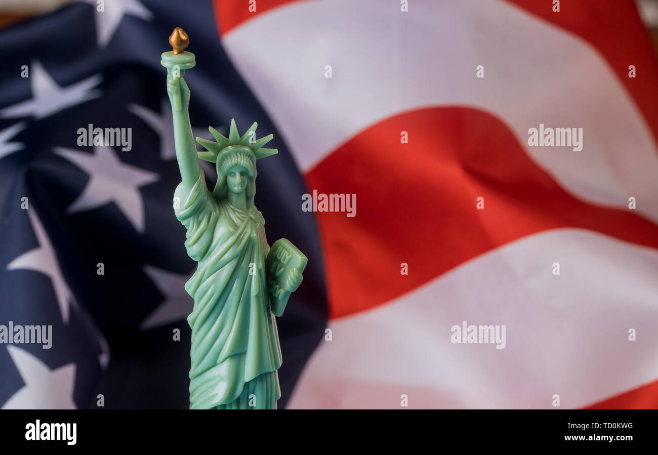 Statue of Liberty in the background of flag USA Stock Photo