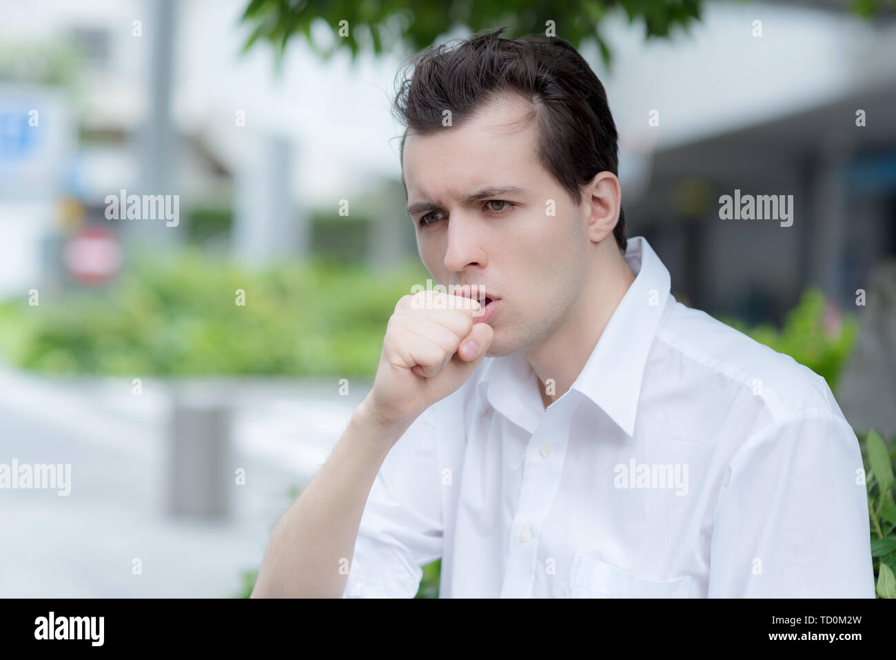 Man is having a cough caused by pollen allergy Stock Photo Alamy