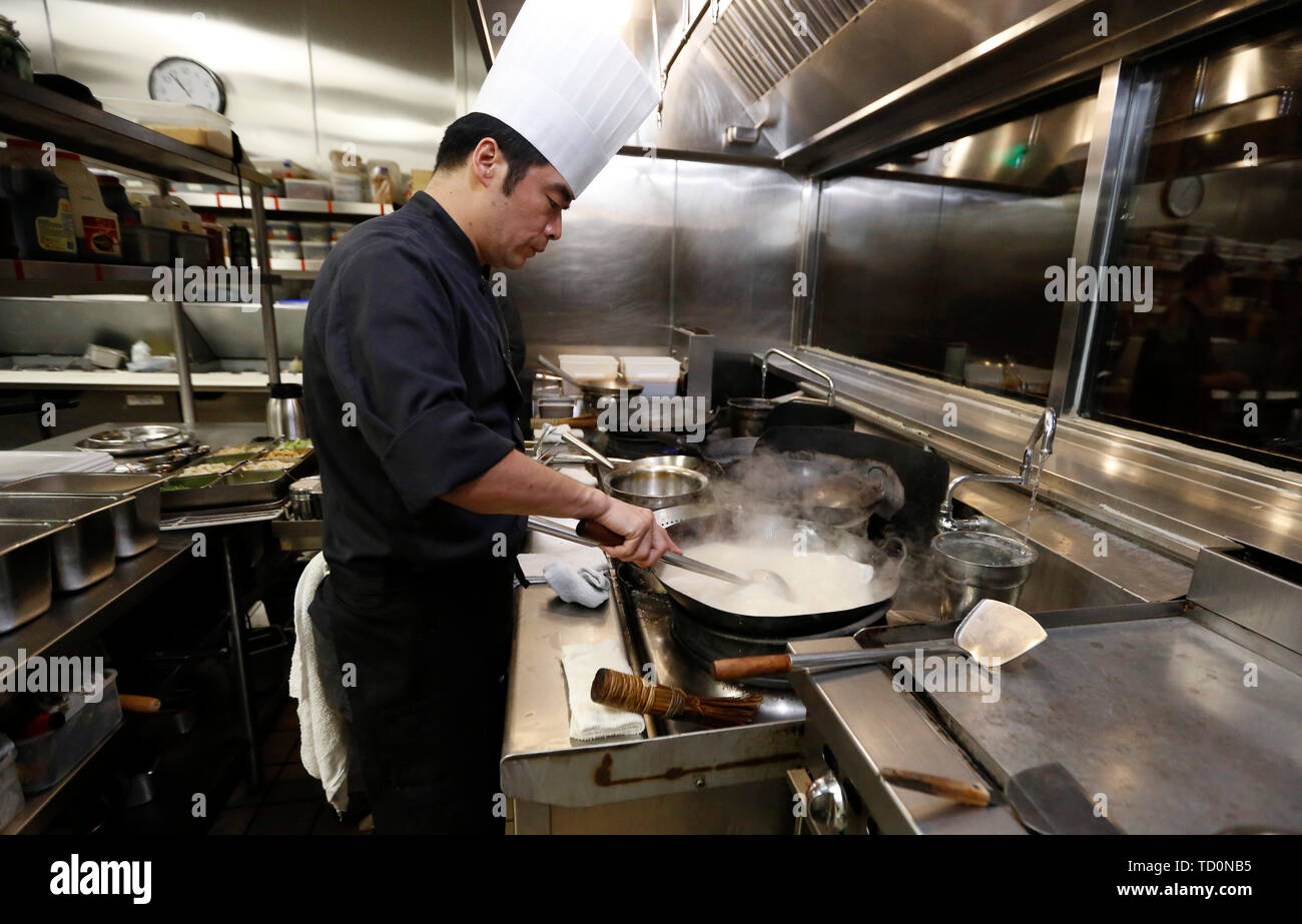 Los Angeles, USA. 7th June, 2019. A chef works at the kitchen of Bistro Na's in Temple City, Los Angeles, the United States, on June 7, 2019. Bistro Na's in Los Angeles made headlines this week with the announcement that it had been awarded a coveted Michelin Star by the famed Michelin Restaurant Guide. This special ranking broke Michelin's 10-year absence from Los Angeles, and made Bistro Na's the only Chinese restaurant in Southern California to be so honored. Credit: Li Ying/Xinhua/Alamy Live News Stock Photo