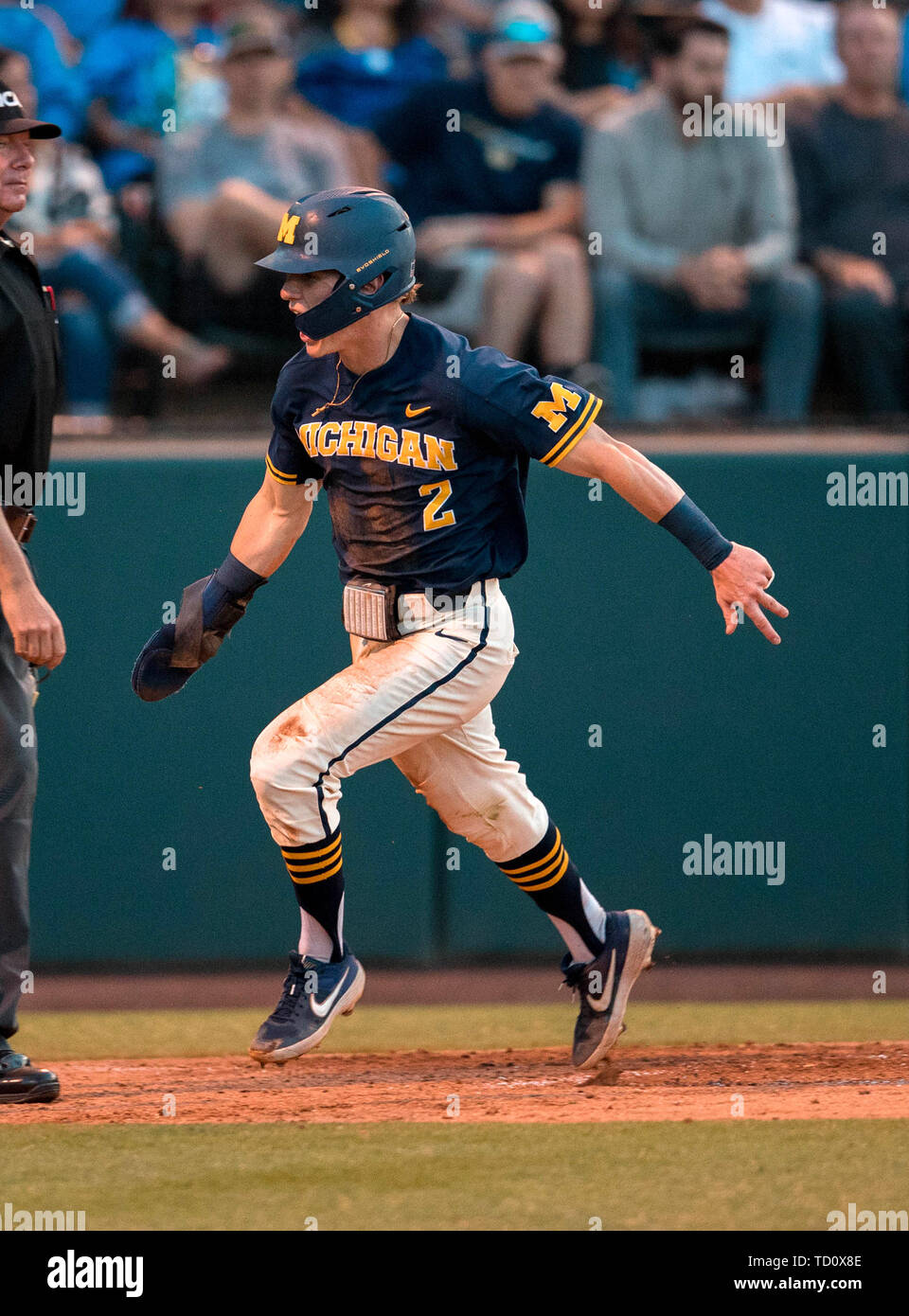 Los Angeles, CA, USA. 09th June, 2019. Michigan infielder (2) Jack Blomgren scores a run after dislocating his finger during an NCAA super regional game between the Michigan Wolverines and the UCLA Bruins at Jackie Robinson Stadium in Los Angeles, California. Michigan defeated UCLA 4-2. (Mandatory Credit: Juan Lainez/MarinMedia.org/Cal Sport Media) Credit: csm/Alamy Live News Stock Photo