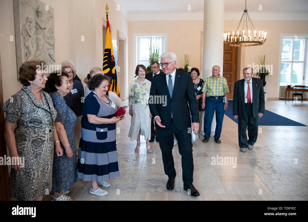 11 June 2019, Berlin: Federal President Frank-Walter Steinmeier welcomes Holocaust survivors from Lithuania for an interview at Bellevue Castle. The group visits Berlin at the invitation of the Maximilian-Kolbe-Werk. The conversation with the Federal President is the highlight of the trip. According to the Maximilian Kolbe plant, more than 20,000 former prisoners of German concentration camps and ghettos still live in the countries of Central and Eastern Europe. For this group, the plant regularly organizes recreational and encounter activities in Germany. Photo: Bernd von Jutrczenka/dpa Stock Photo