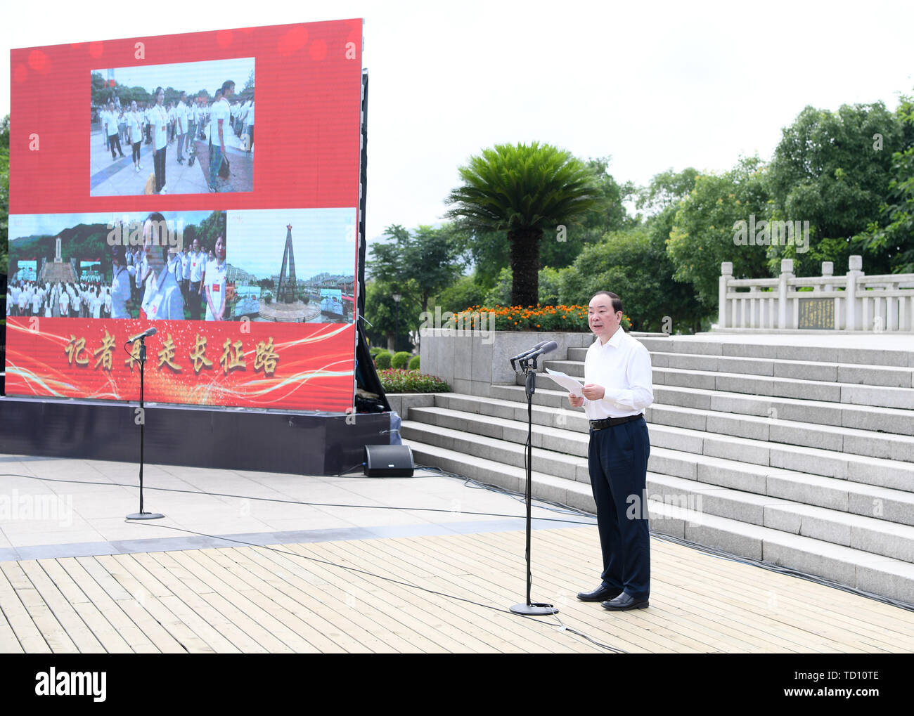 (190611) -- NANCHANG, June 11, 2019 (Xinhua) -- Huang Kunming, a member of the Political Bureau of the Communist Party of China (CPC) Central Committee and head of the Publicity Department of the CPC Central Committee, attends the launching ceremony of an activity that will take journalists to retrace the route of the Long March in Yudu County of Ganzhou City, east China's Jiangxi Province, June 11, 2019. The Long March was a military maneuver carried out by the Chinese Workers' and Peasants' Red Army from 1934 to 1936. During this period, they left their bases and marched through rivers, moun Stock Photo