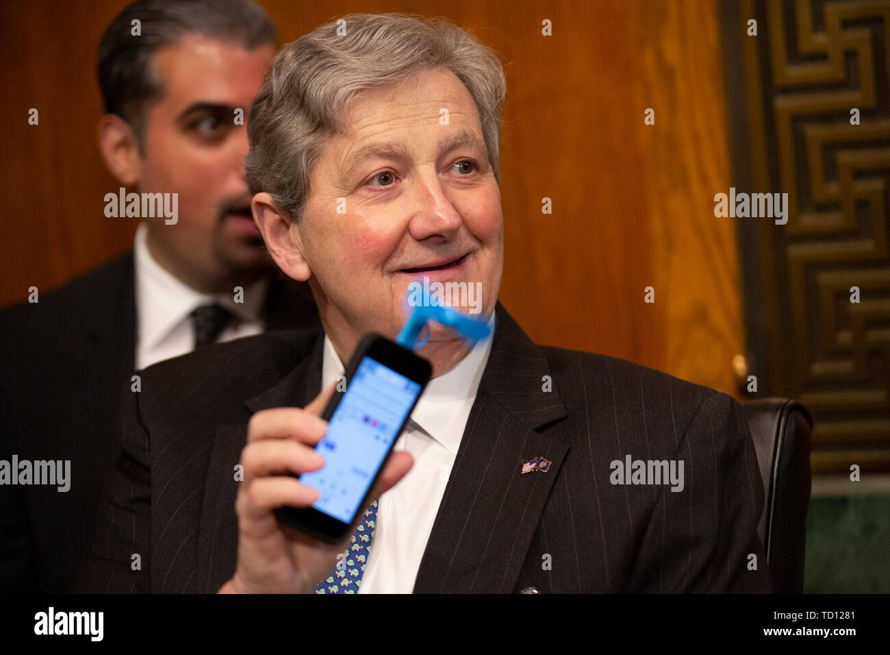 Washington DC, USA. 11th June, 2019. United States Senator John Kennedy (Republican of Louisiana) shows off a phone-fan prior to the testimony of Acting Secretary of the United States Department of Homeland Security Kevin McAleenan before the U.S. Senate Judiciary Committee on Capitol Hill in Washington, DC, U.S. on June 11, 2019. Credit: MediaPunch Inc/Alamy Live News Stock Photo