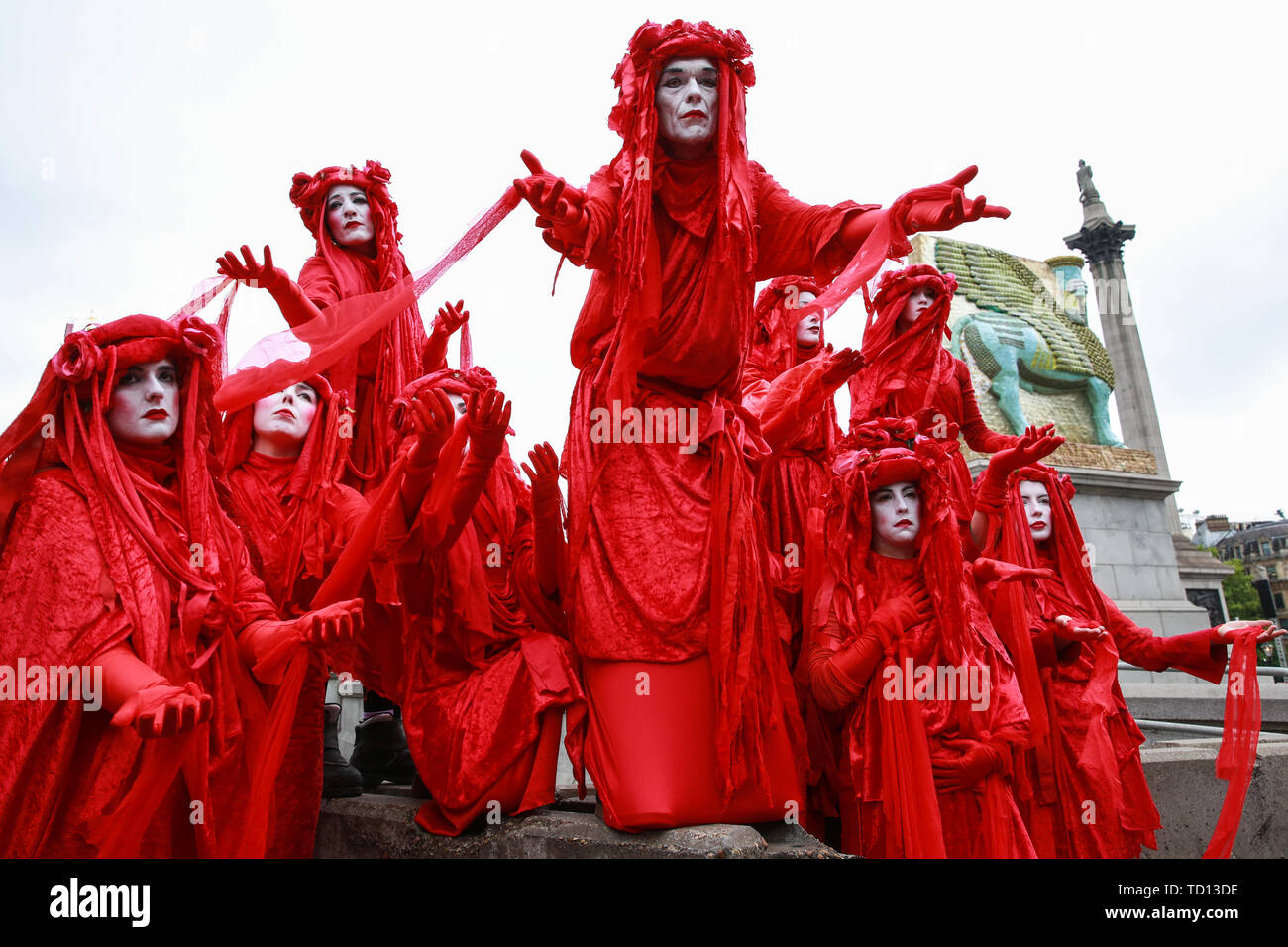 London, UK. 11 June, 2019. The Blood of the Extinction theatrical group join fellow activists from Extinction Rebellion in disrupting the Royal Opera House BP Big Screen’s Romeo and Juliet event in Trafalgar Square in protest against oil sponsorship of the arts. Activists at the ‘Petroleo and Fueliet’ protest highlighted the contradiction between the Government and Greater London Authority having declared a climate emergency and BP being given a platform to sponsor the Royal Opera House event in the heart of London. Credit: Mark Kerrison/Alamy Live News Stock Photo