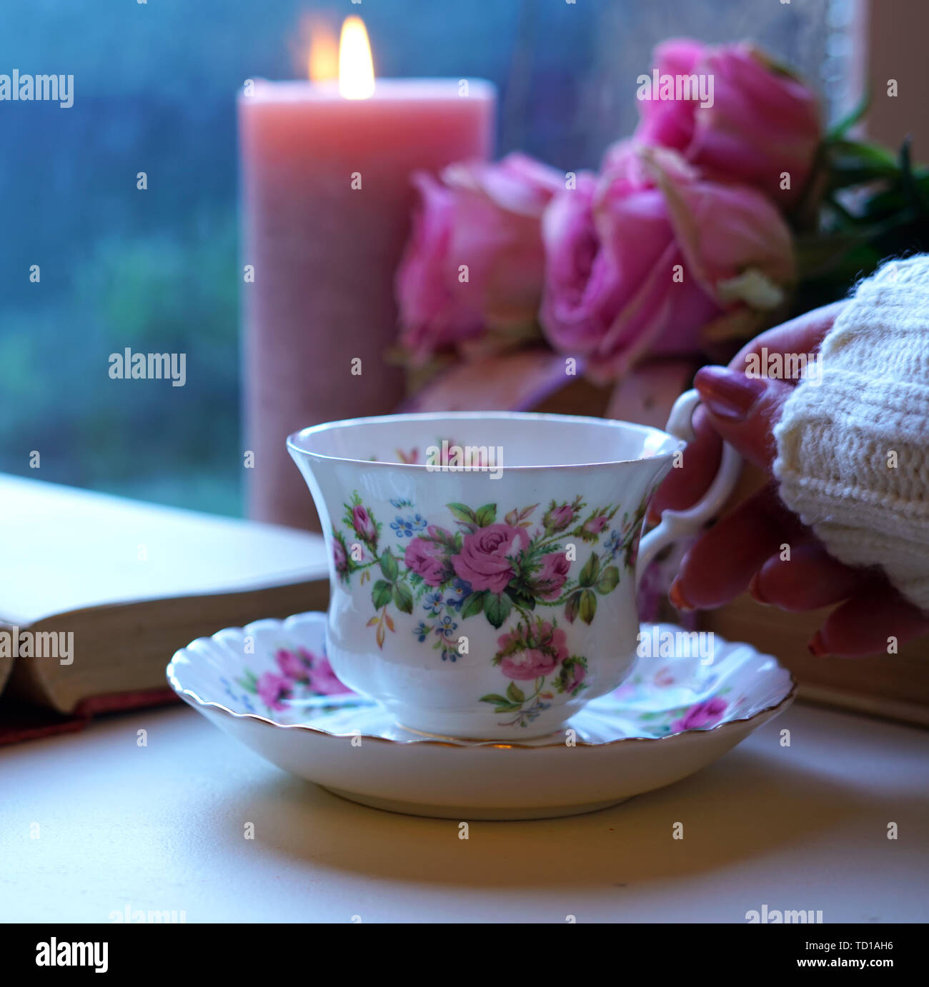 Nostalgia Scene Relaxing By The Window On A Cold Rainy Day With Old Books And Cup Of Tea Stock Photo Alamy