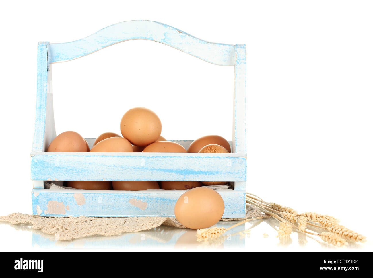 Eggs in blue wooden basket isolated on white Stock Photo - Alamy