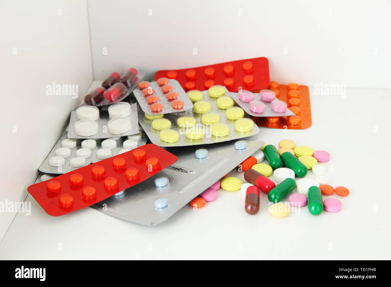Colorful pills and capsules on shelf Stock Photo Alamy