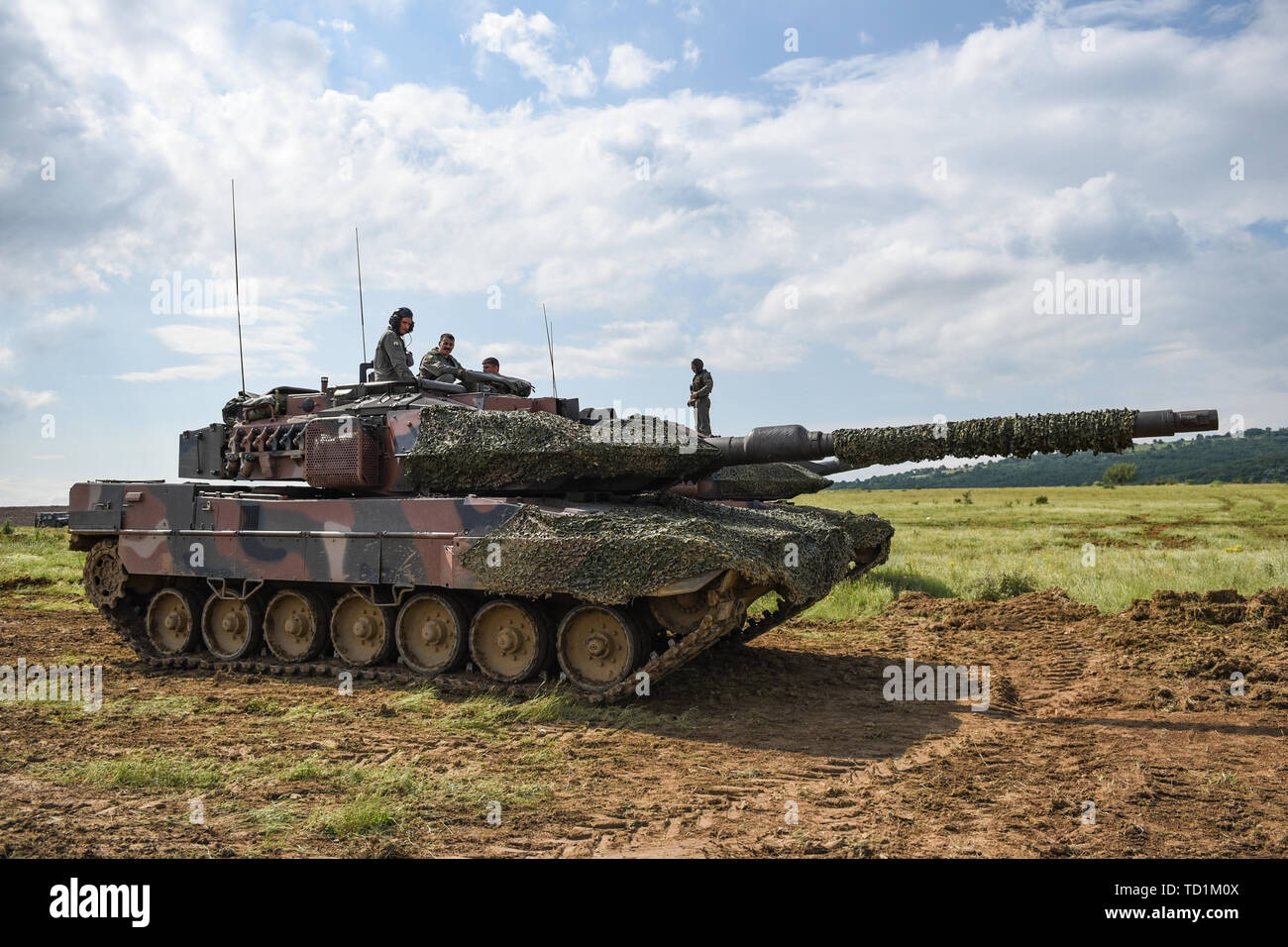 A platoon of German Leopard tanks controlled by the Greek Army prepare to fire upon distant targets June 10, 2019 on Novo Selo Training Area, Bulgaria, as a part of STRIKE BACK 19. This was the beginning of the second day of a two-part exercise in which a hilltop fighting position was lost and must be regained with the help of two platoons of U.S. Army Bradley Fighting Vehicles from 1 Battalion 16th Infantry Regiment and a Bulgarian armored unit.    STRIKE BACK 19 is a multinational exercise hosted by the Bulgarian Armed Forces at Novo Selo Training Area, Bulgaria, from June 6-20, 2019. STRIKE Stock Photo