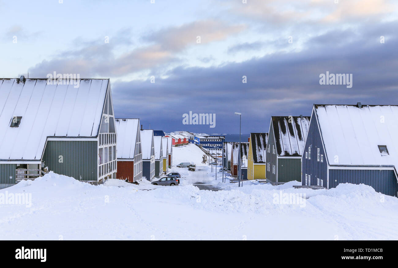 Street full of snow with colorful Inuit houses in  arctic Nuuk city, Greenland Stock Photo