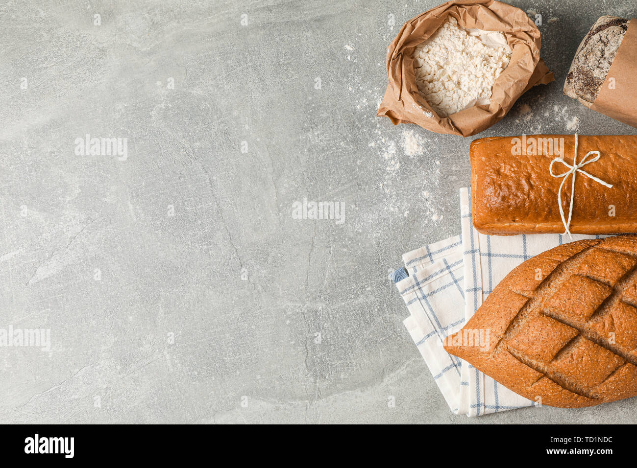 Bakery products composition on grey background, top view and space for text Stock Photo