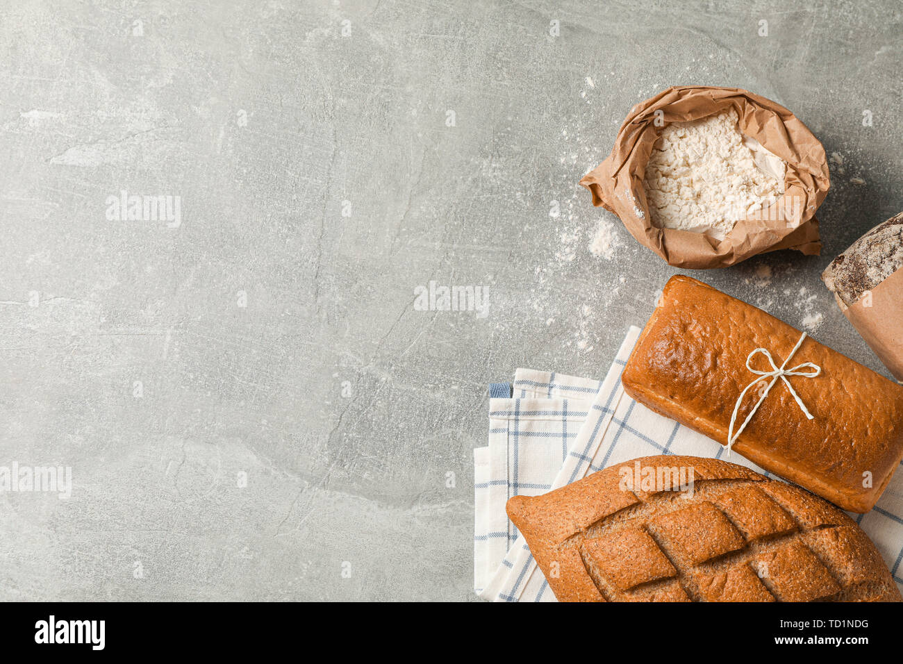 Bakery products composition on grey background, top view and space for text Stock Photo