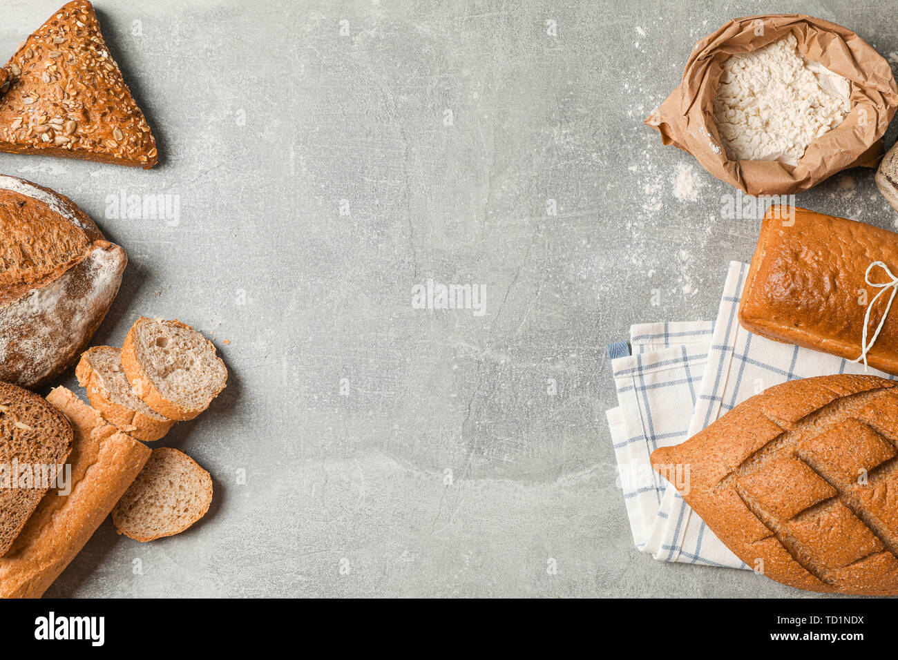 Bakery products composition on grey background, top view and space for text Stock Photo