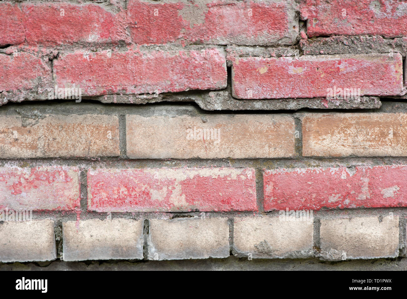 Weathered stained old brick wall for texture or background Stock Photo