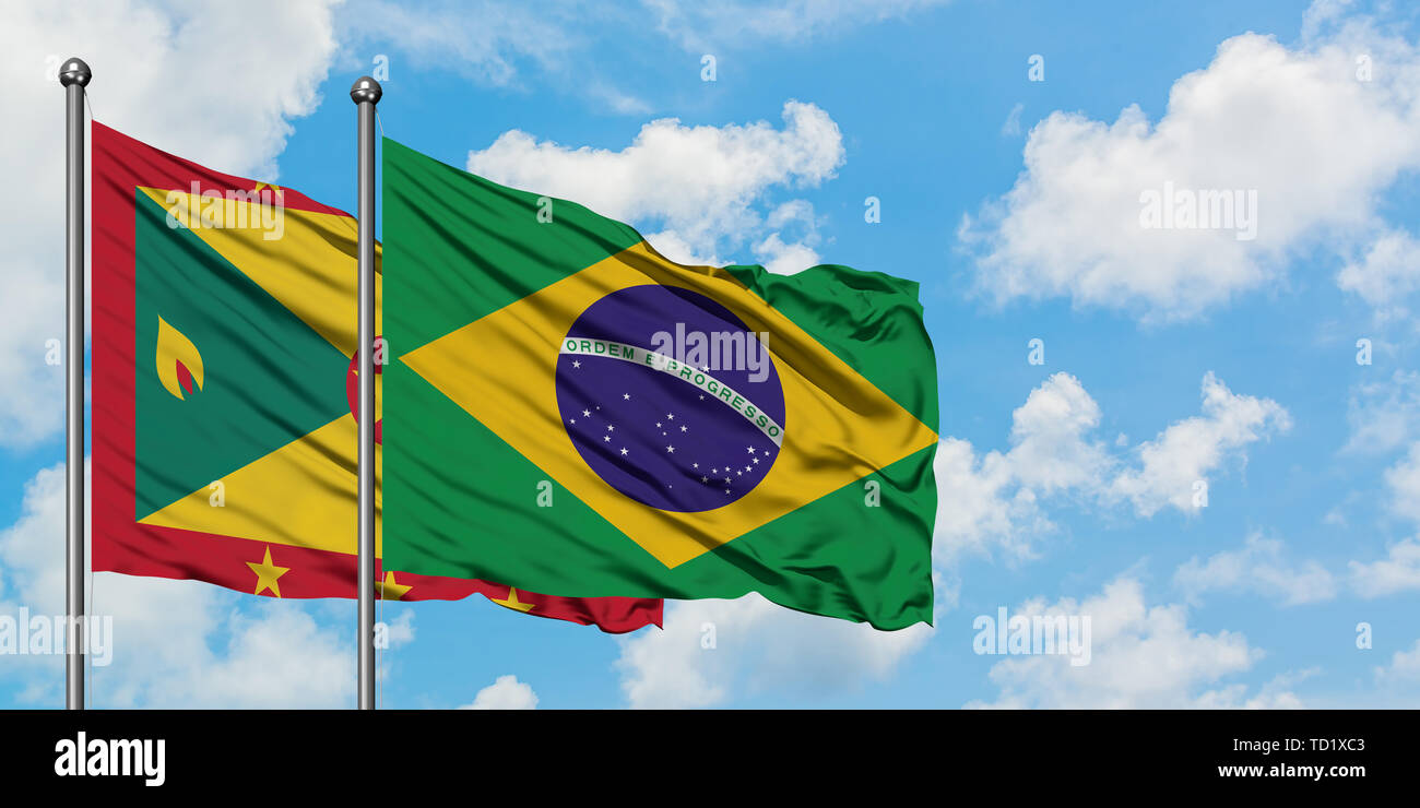 Grenada and Brazil flag waving in the wind against white cloudy blue ...