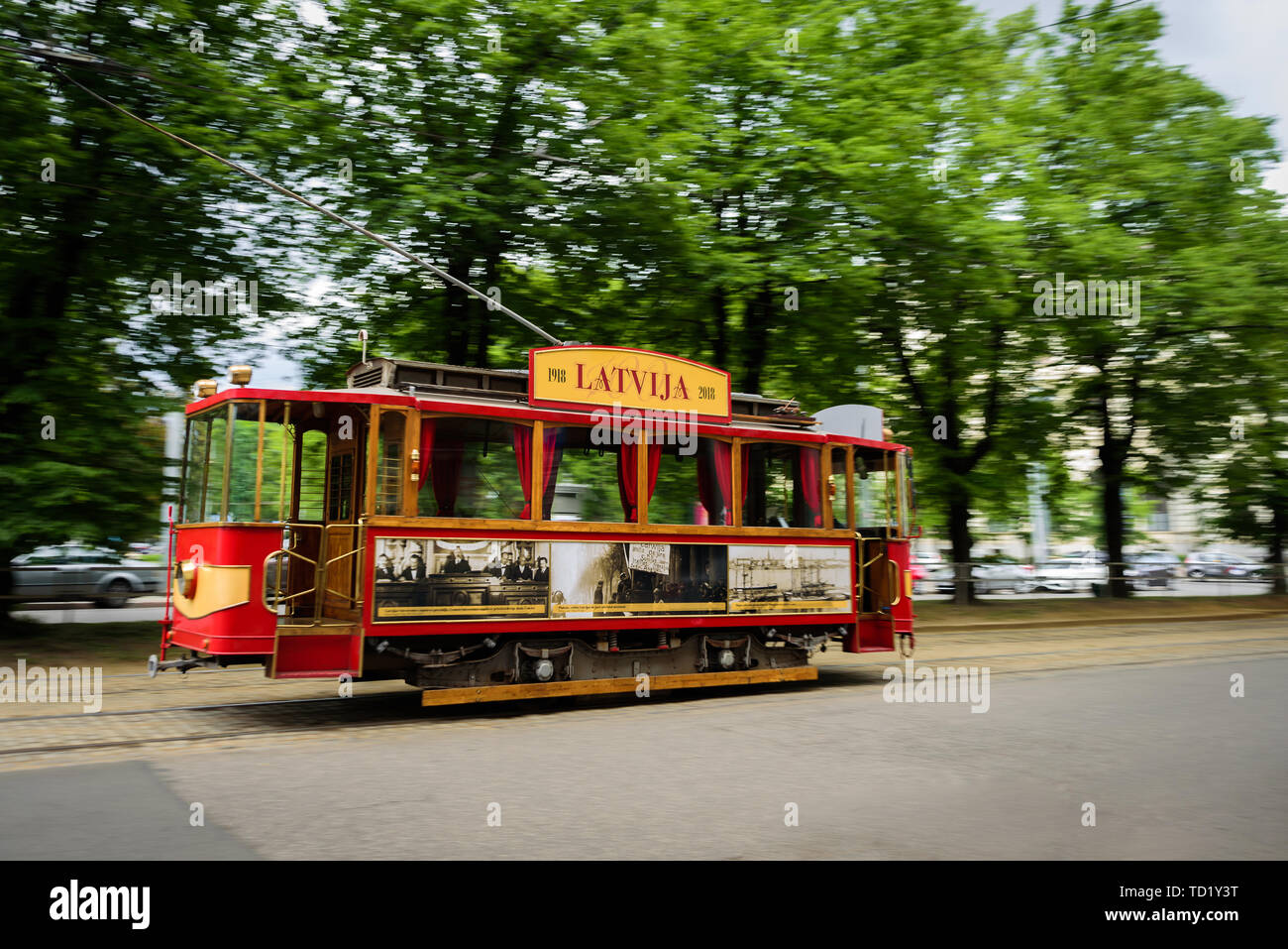Riga, Latvia - May 25, 2019: Old historical tram on street of Riga. In motion, selective focus Stock Photo