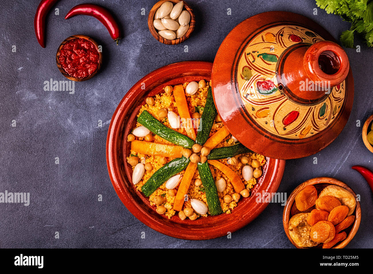 Vegetable tagine with almond and chickpea couscous, top view Stock