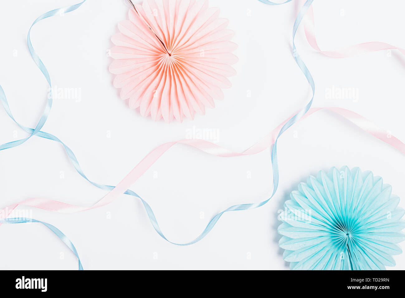 Pastel White Background Of Paper Party Decorations And Silk