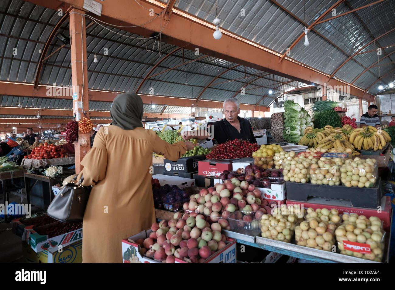 Vendor selling fruits at the market in the Palestinian city of Jenin in the northern Palestinian
