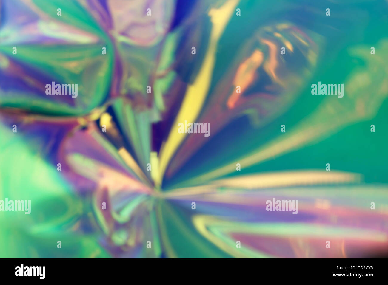 Blurred photo of a trendy abstract colorful holographic material. Futuristic concept. Stock Photo