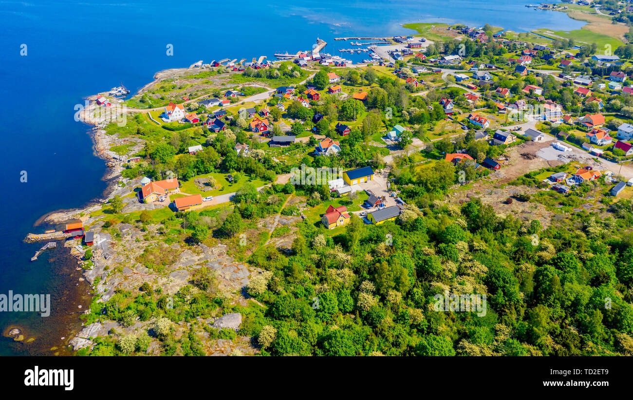 Aerial of island village and surrounding landscape on a sunny summer day. Location Hasslo island in Blekinge archipelago, Sweden. Stock Photo