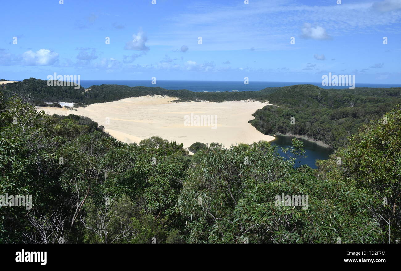 Landscape of dunes and Lake Wabby in Fraser Island (Sunshine Coast, Queensland, Australia). Lake Wabby is a small freshwater, green colored lake. It i Stock Photo