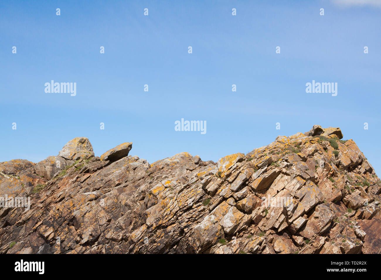 Rocks photographed against an idyllic blue sky in the Shetland Isles ...