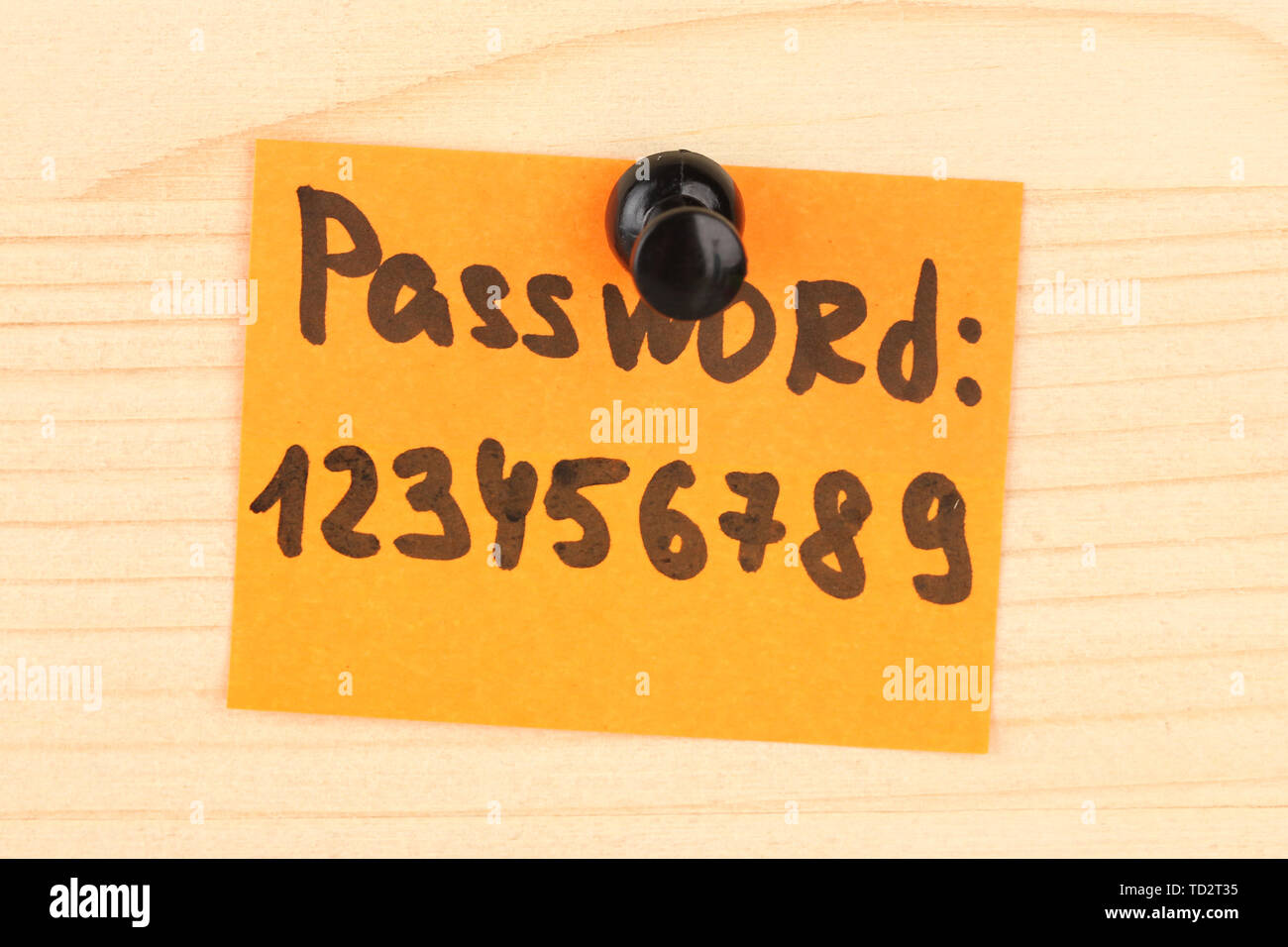 Sticker-reminder with most popular password, on wooden background Stock Photo