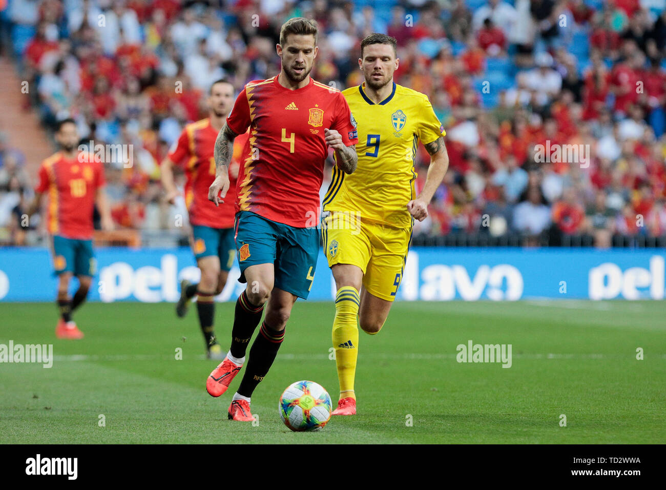 Spain national team player Inigo Martinez and Sweden national team player Marcus Berg seen in action during the UEFA EURO 2020 Qualifier match between Spain and Sweden at Santiago Bernabeu Stadium in Madrid. Final score: Spain 3 - Sweden 0 Stock Photo