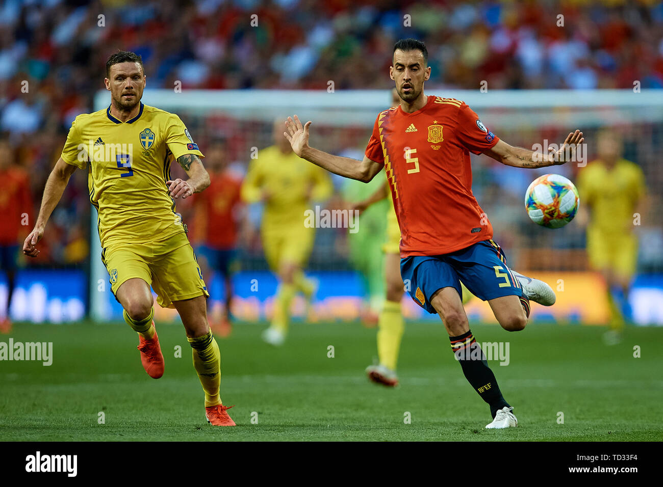 MADRID, SPAIN - JUNE 10: Sergio Busquets (R) of Spain in action next to Marcus Berg of Sweden during the UEFA Euro 2020 qualifier match between Spain and Sweden at Santiago Bernabeu on June 10, 2019 in Madrid, Spain. (Photo by David Aliaga/MB Media) Stock Photo