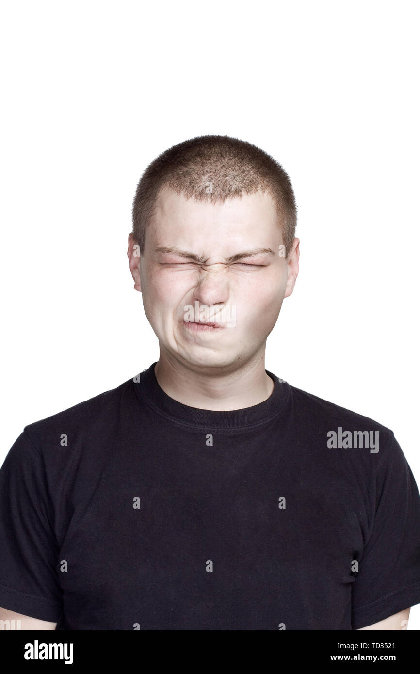 Portrait of young man. Facial expression. disgusting face Stock Photo
