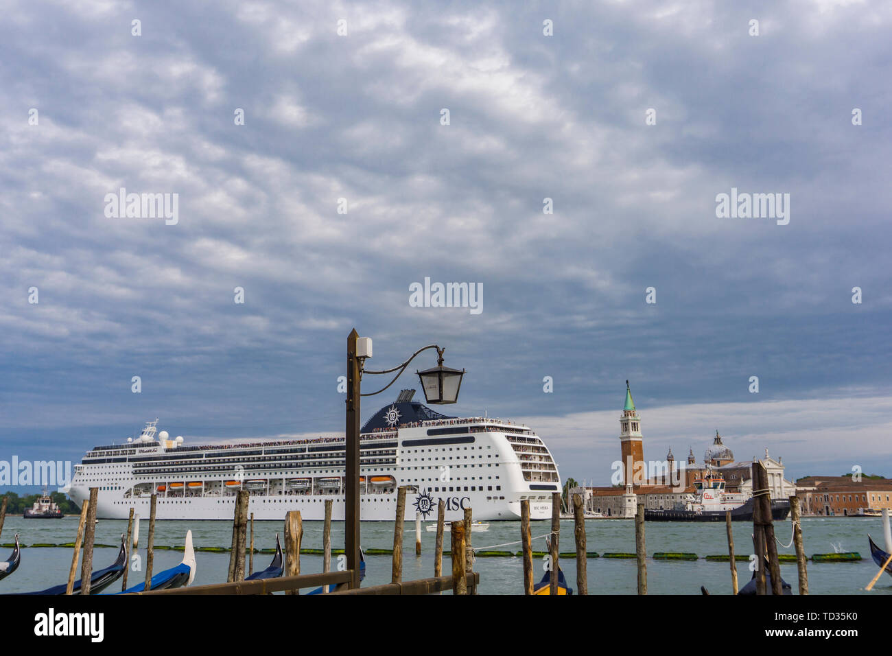 VENICE, ITALY - MAY 26, 2019: View at MSC Opera cruise ship in Venice, Italy. This 13 decks ship was launched at 2004 and have capacity of 2679 passen Stock Photo