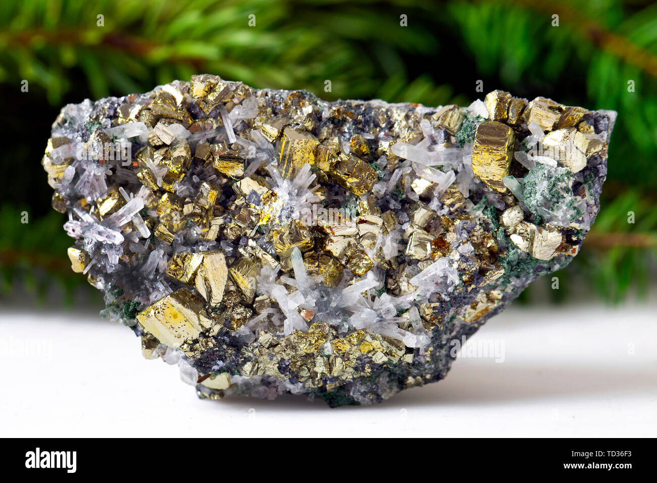 Macro shooting of natural gemstone. The raw mineral is pyrite, China. Isolated object on a white background. Stock Photo