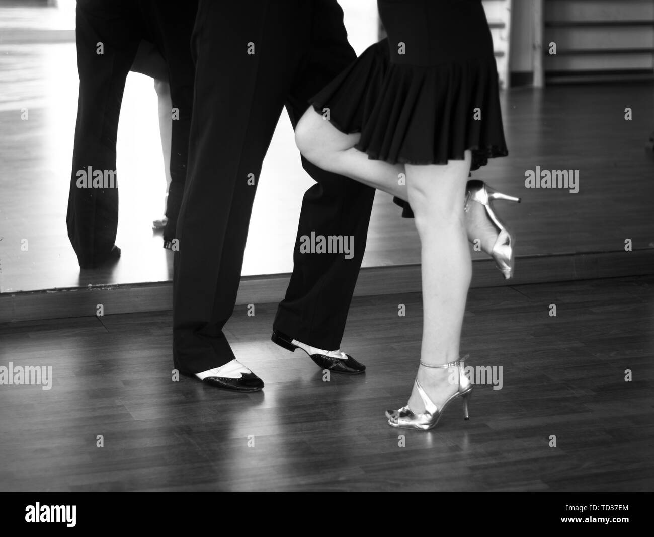 Ballroom dance salsa dancer instructors man and woman couple dancing in