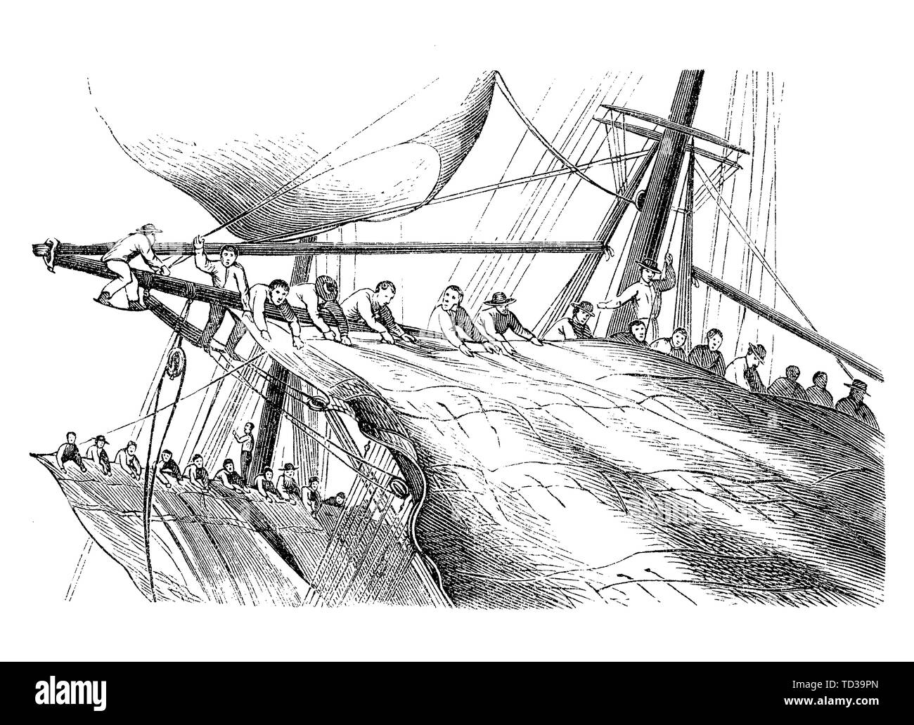 Sailors climbing on the masts recover and reduce the sails against the strong wind Stock Photo