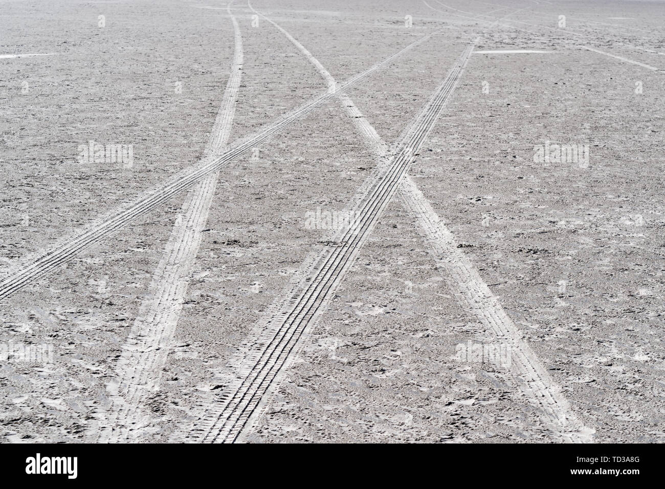 Tracks of a car wheels in a sand. Sankt PeterOrding beach in North