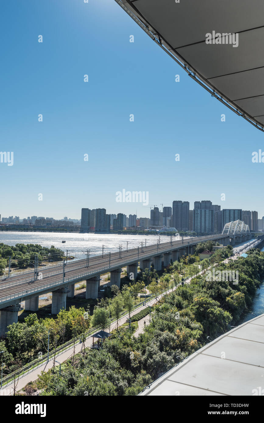 Songhua River Railway Bridge under Autumn Sunny Day in Harbin, China Stock Photo