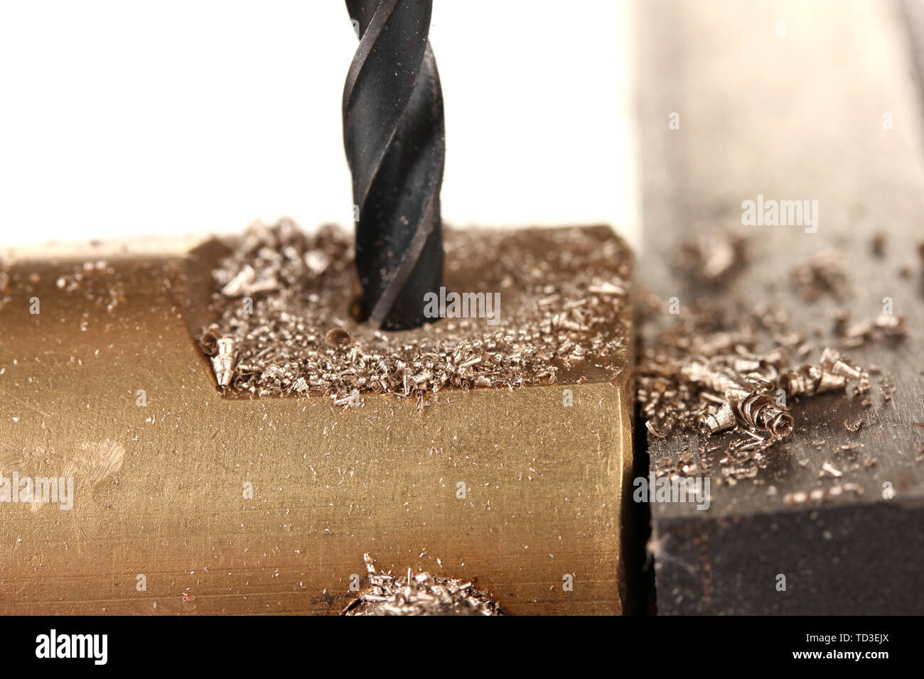 Drilling hole into metal, isolated on white Stock Photo Alamy