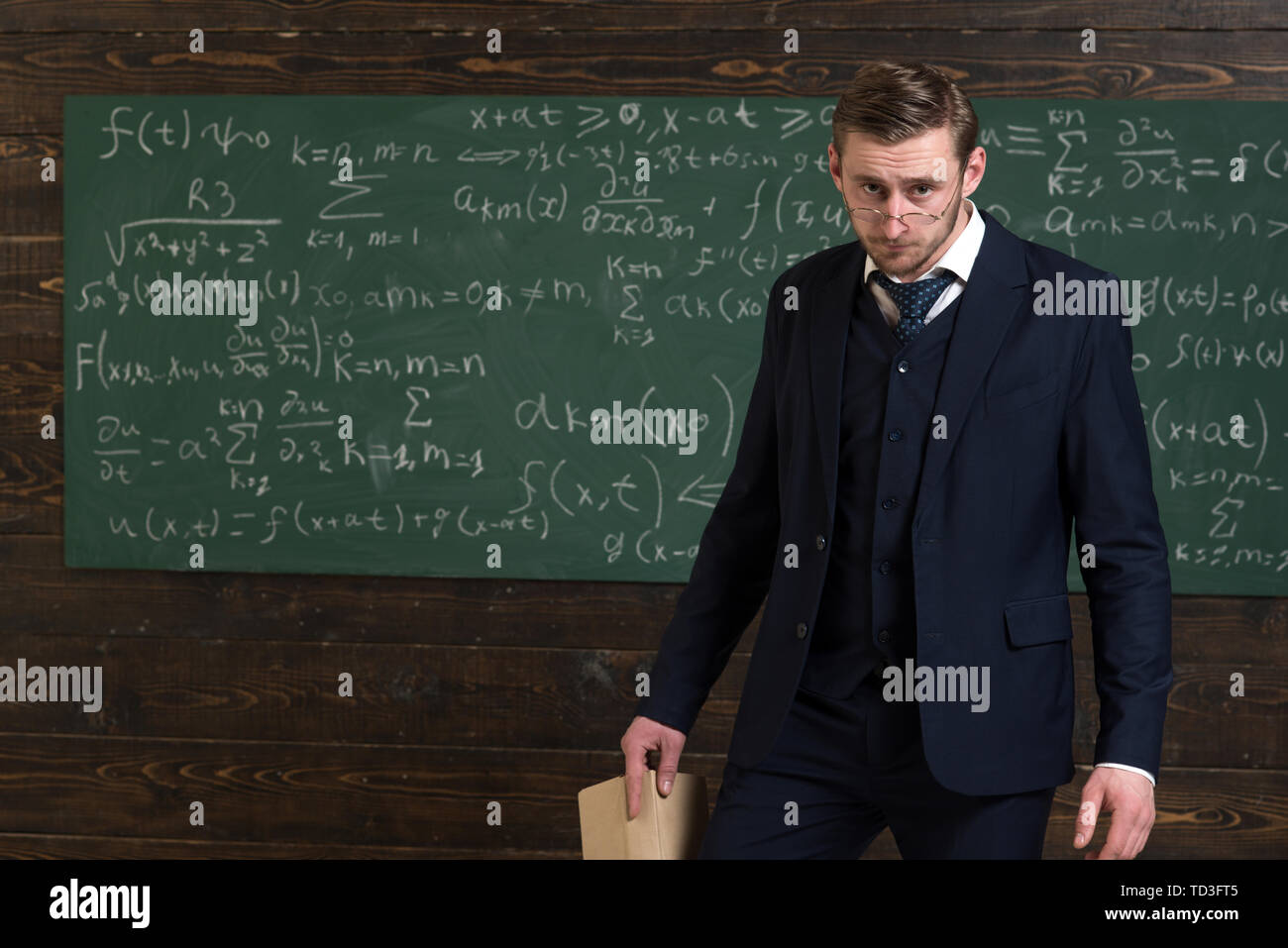 Exacting teacher. Teacher formal wear and glasses looks smart ...