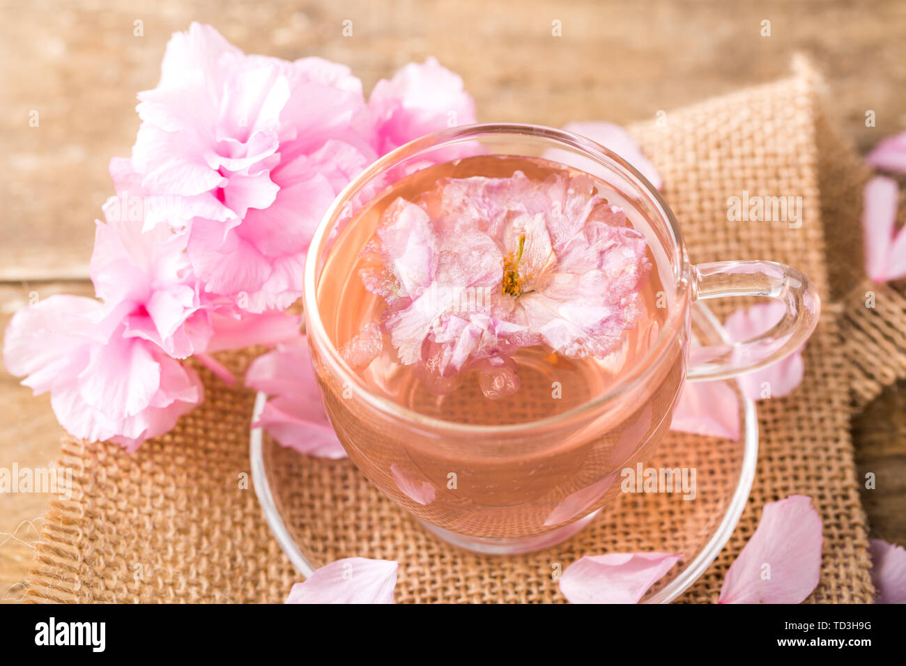 Cherry blossom tea, cup of fresh pink cherry blossom tea and cherry ...