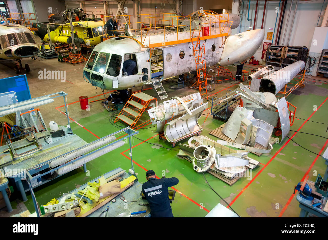 Tyumen, Russia - June 5, 2019: Aircraft repair helicopter UTair Engineering plant. Mi-8 helicopter during maintencance and repair at the service hanga Stock Photo