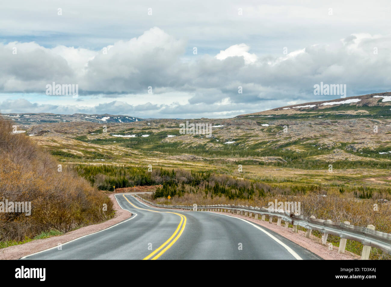 The Trans Labrador Highway near L'Anse-au-Loup. Pockets of snow still on ground in late June. Stock Photo