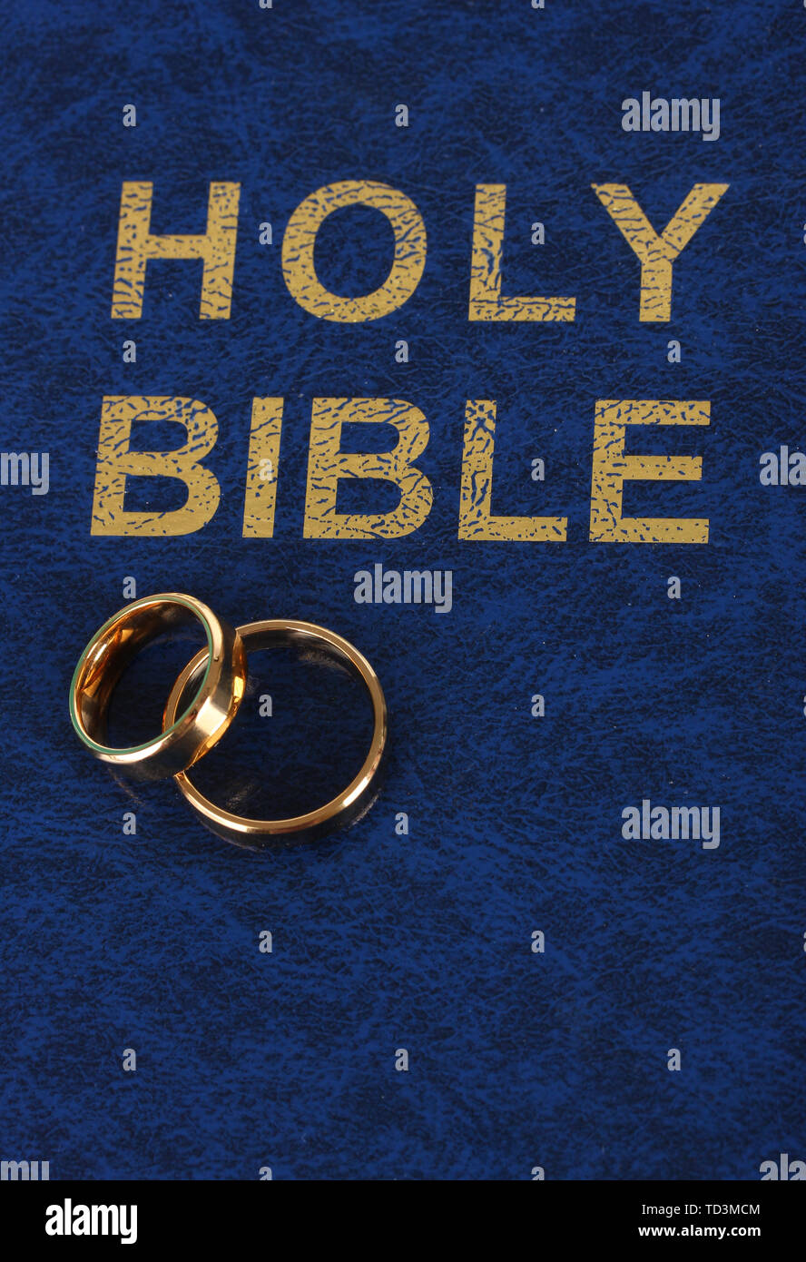 Wedding rings on bible Stock Photo Alamy