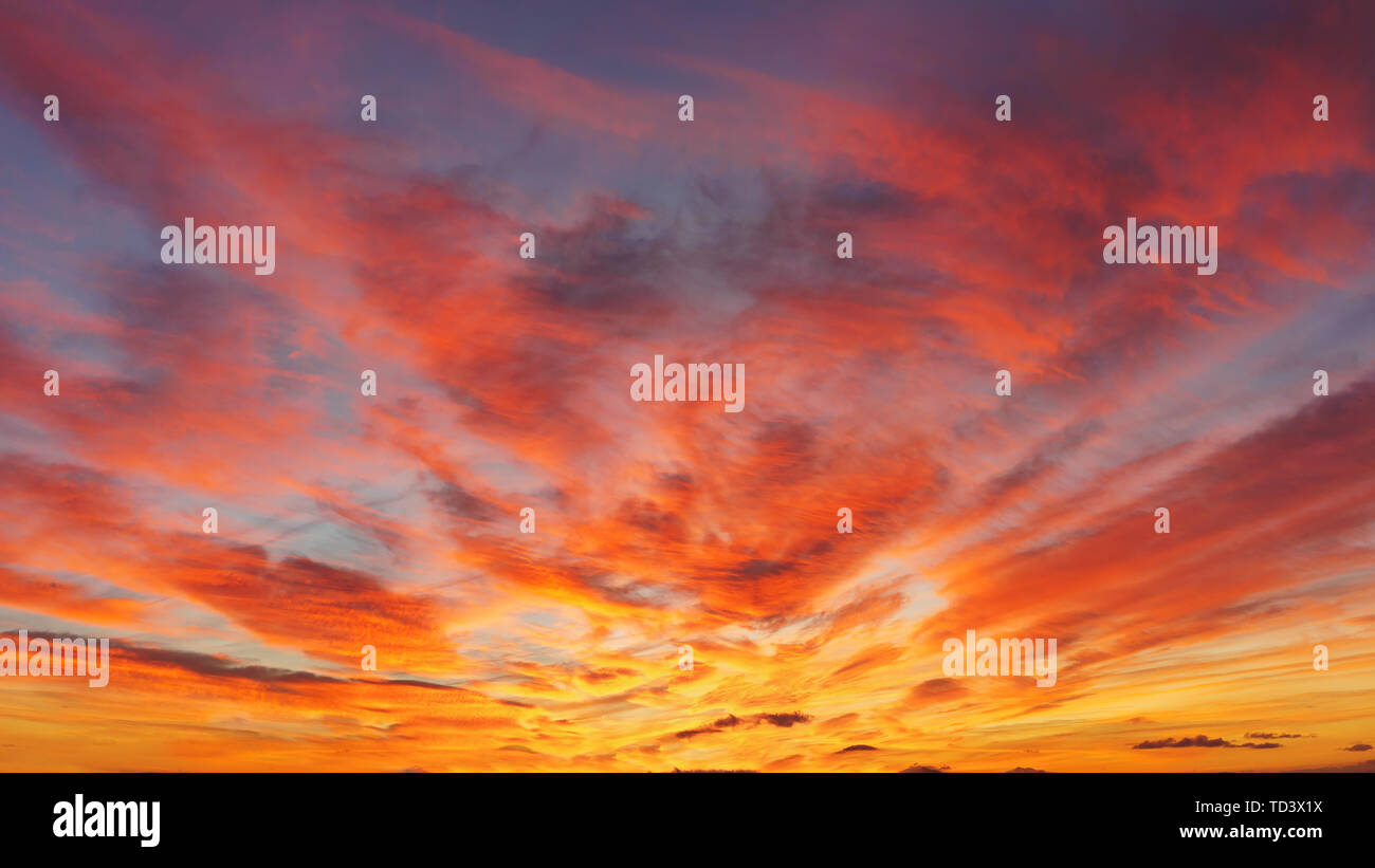 beautiful cloudscape at sunset with red clouds on sky Stock Photo - Alamy