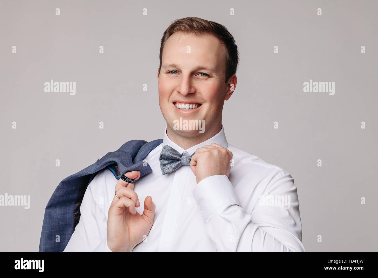 Portrait of handsome man in black suit Stock Photo - Alamy